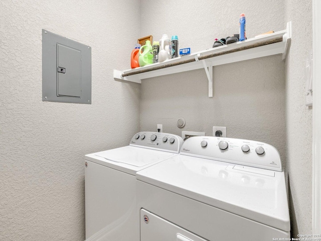 washroom featuring electric panel and separate washer and dryer