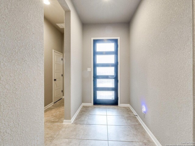 view of tiled foyer entrance