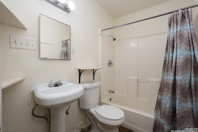 bathroom with toilet and shower / tub combo