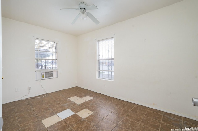 tiled empty room with plenty of natural light, cooling unit, and ceiling fan