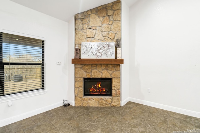 unfurnished living room with a fireplace and vaulted ceiling