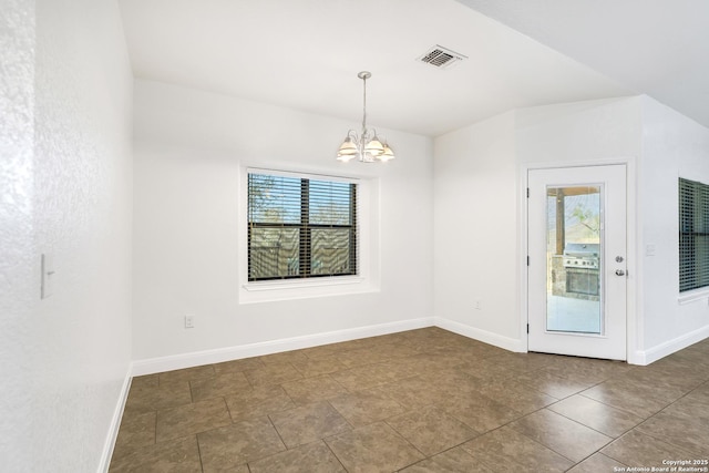 empty room with a chandelier