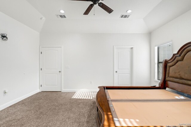 carpeted bedroom featuring ceiling fan, lofted ceiling, and a closet