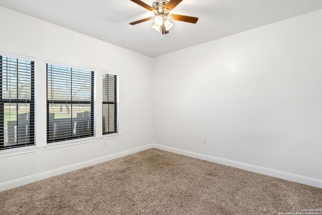 carpeted empty room with ceiling fan