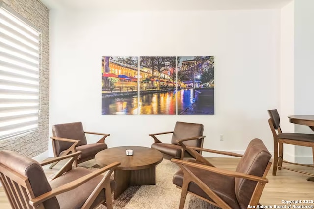 living area with hardwood / wood-style flooring