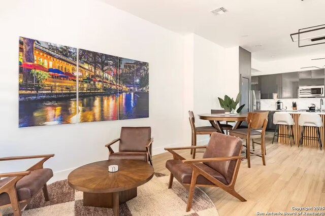 living area featuring light hardwood / wood-style flooring