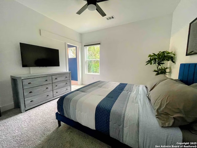 carpeted bedroom with ceiling fan