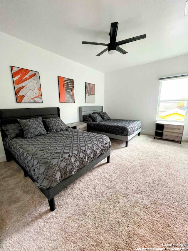 carpeted bedroom featuring ceiling fan