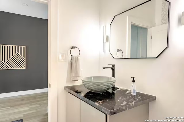 bathroom featuring vanity and hardwood / wood-style flooring