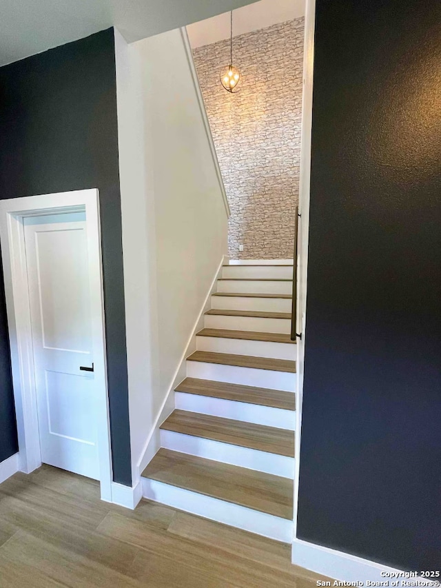 stairway featuring hardwood / wood-style flooring