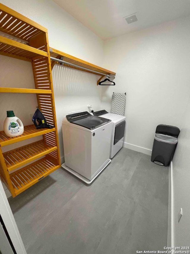 laundry room with separate washer and dryer