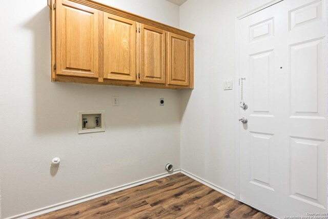 laundry area with cabinets, hookup for a washing machine, dark hardwood / wood-style flooring, and electric dryer hookup