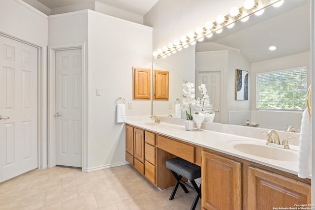 bathroom featuring a tub, tile patterned flooring, and vanity