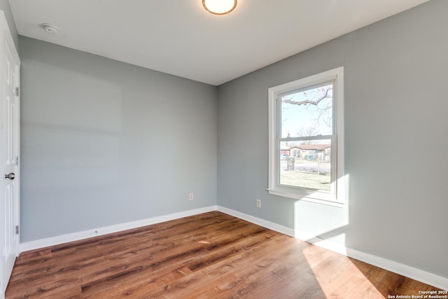 empty room featuring wood-type flooring