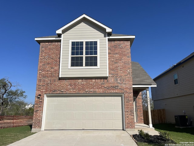 front of property with cooling unit and a garage