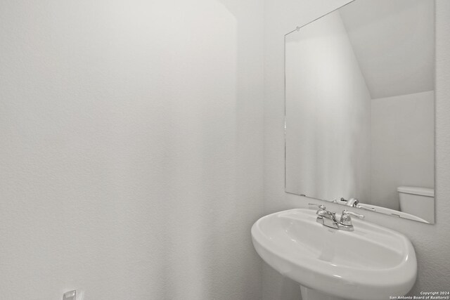 4906 Sandstone Way, San Antonio, TX 78222 - bathroom with toilet and sink