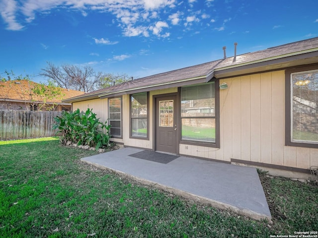 doorway to property featuring a yard and a patio