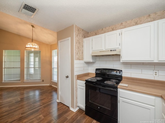 kitchen with backsplash, vaulted ceiling, white cabinets, black range with electric stovetop, and hanging light fixtures