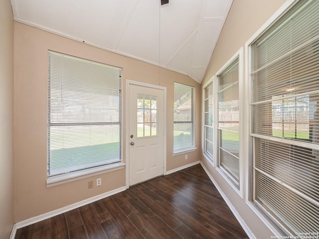 interior space featuring dark hardwood / wood-style floors and vaulted ceiling