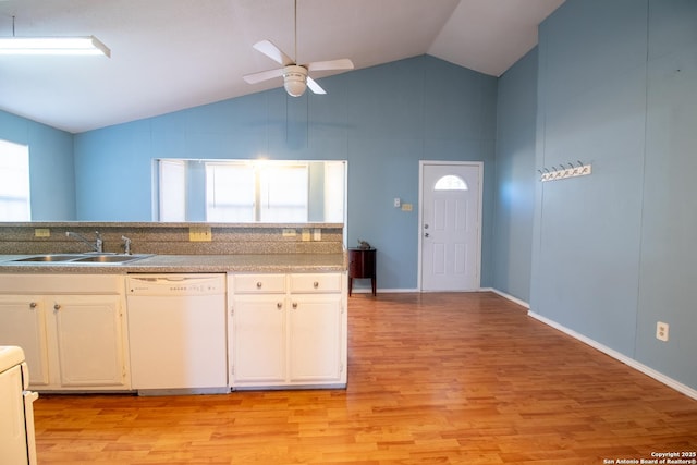 kitchen featuring white dishwasher, white cabinets, sink, ceiling fan, and light wood-type flooring