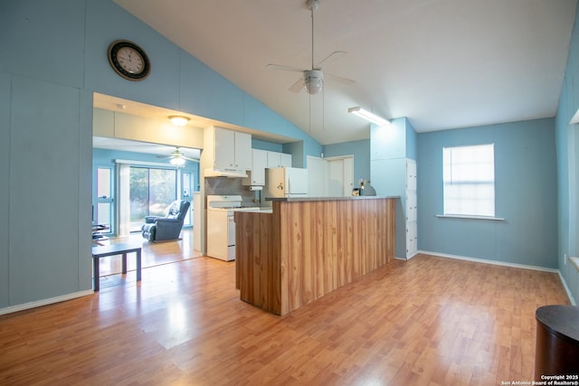 kitchen with kitchen peninsula, tasteful backsplash, white appliances, light hardwood / wood-style floors, and white cabinetry