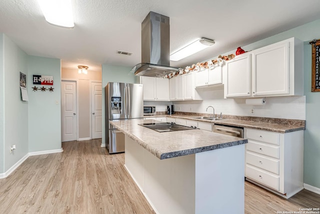 kitchen with white cabinetry, a center island, stainless steel appliances, island exhaust hood, and light hardwood / wood-style floors