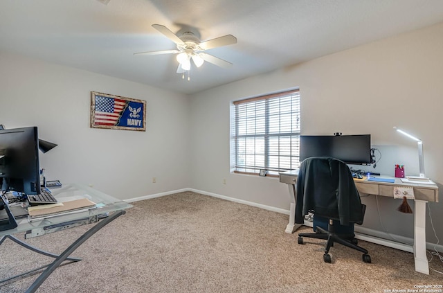 carpeted office featuring ceiling fan