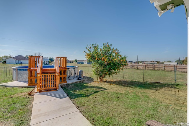 view of yard with a fenced in pool