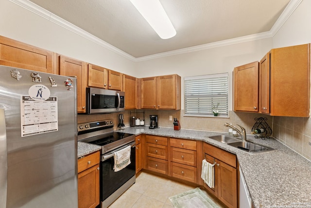 kitchen featuring decorative backsplash, appliances with stainless steel finishes, crown molding, sink, and light tile patterned floors