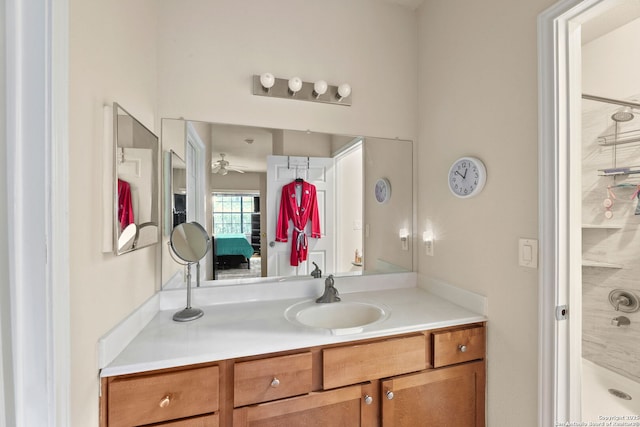 bathroom featuring a shower, vanity, and ceiling fan