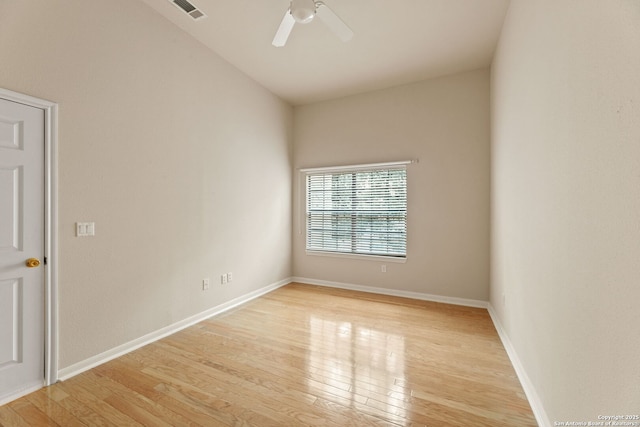 empty room featuring ceiling fan and light wood-type flooring