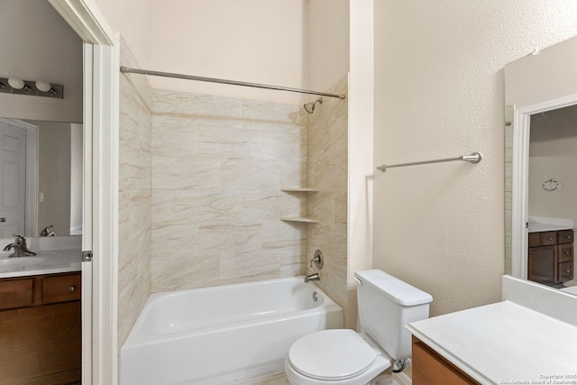 full bathroom featuring vanity, toilet, and tiled shower / bath