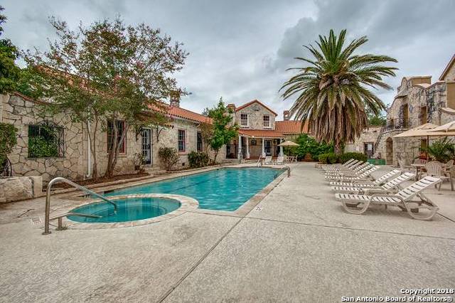 view of swimming pool featuring a community hot tub and a patio area