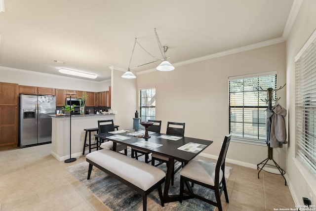 tiled dining area with ornamental molding