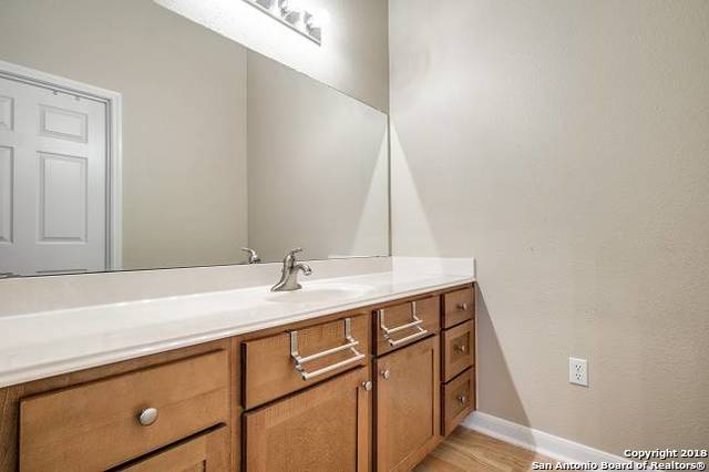 bathroom with vanity and hardwood / wood-style flooring