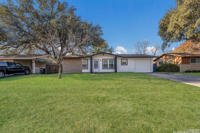 ranch-style home with a front yard and a garage