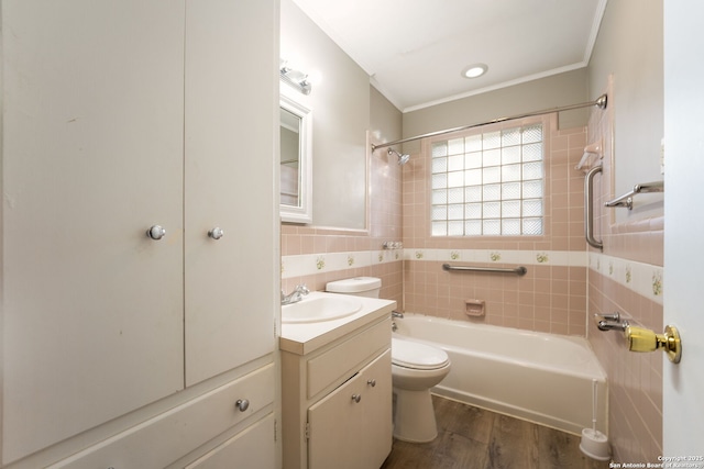 full bathroom featuring vanity, shower / tub combination, tile walls, hardwood / wood-style floors, and toilet