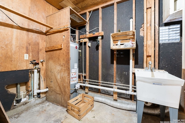 utility room with sink and water heater