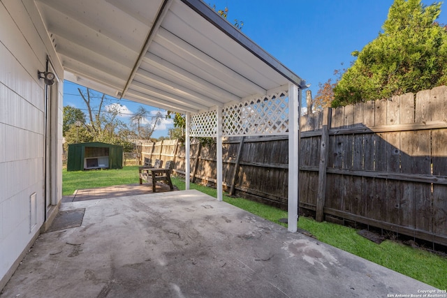 view of patio with a storage unit