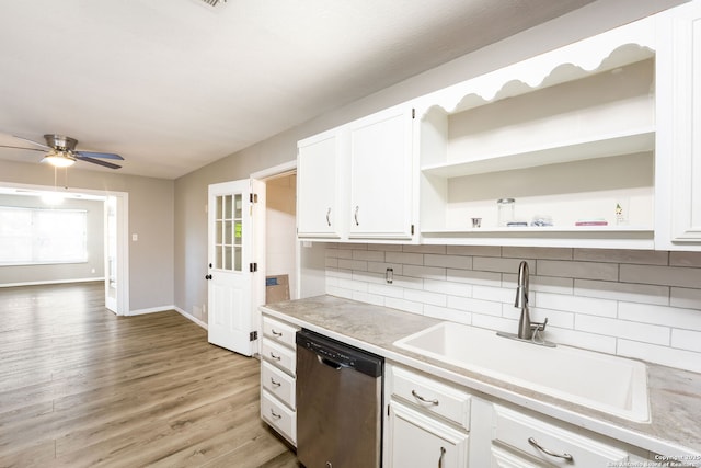 kitchen with tasteful backsplash, stainless steel dishwasher, ceiling fan, sink, and white cabinets