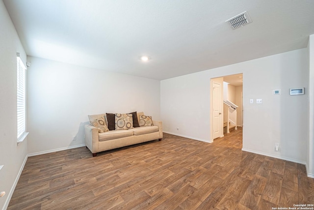 unfurnished room with wood-type flooring and a wealth of natural light