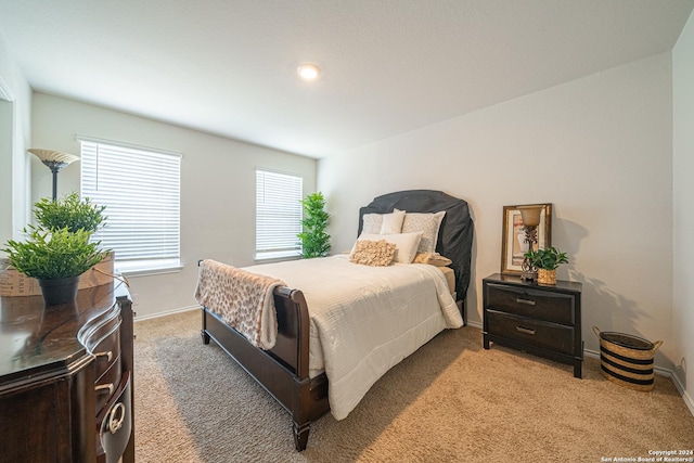 bedroom with dark carpet