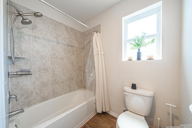 bathroom featuring wood-type flooring, shower / bath combo, and toilet