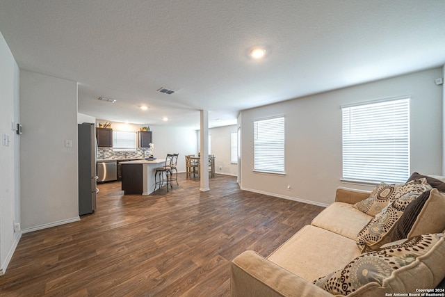 living room with dark hardwood / wood-style flooring