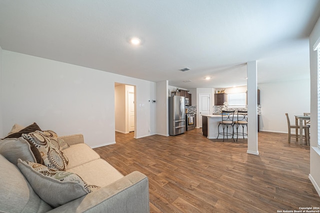 living room with dark wood-type flooring