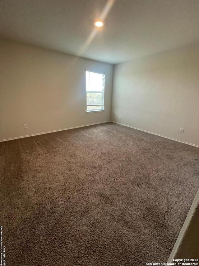 spare room featuring carpet