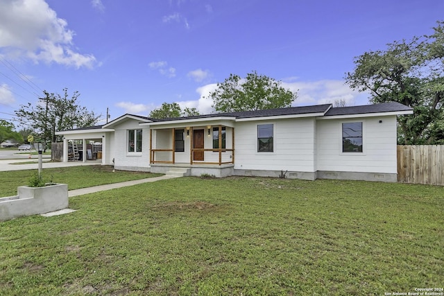 ranch-style home featuring a front lawn, a carport, and a porch