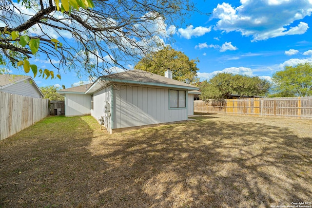 view of outbuilding featuring a lawn