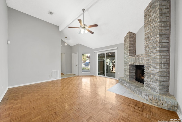 unfurnished living room featuring a fireplace, lofted ceiling with beams, light parquet floors, and ceiling fan