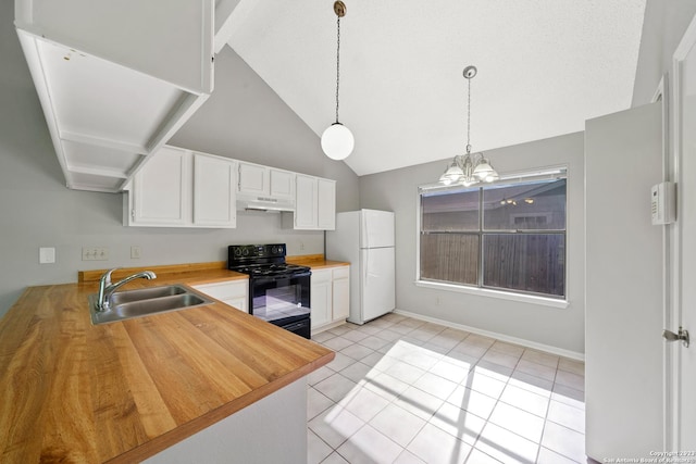 kitchen with black range with electric stovetop, white cabinetry, light tile patterned floors, and white refrigerator